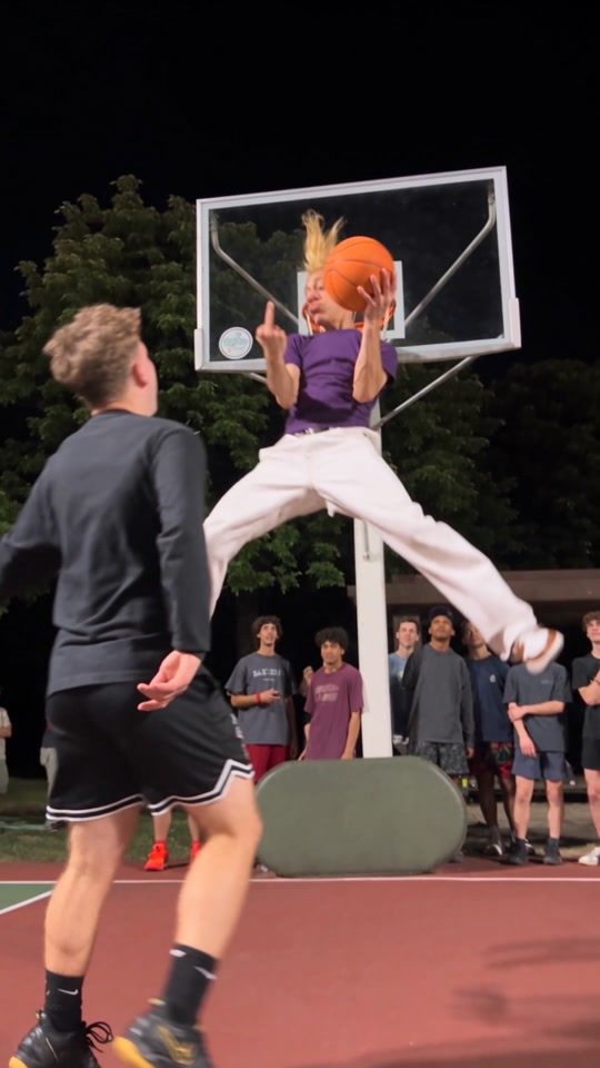 Teuteuf suspended above the defender in the viral Middle Finger Dunk video